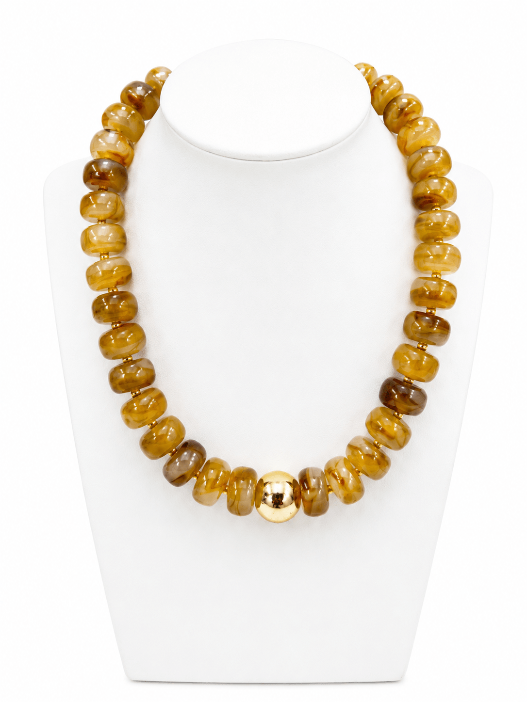 Strand of matte beads punctuated with gold-tone rounds