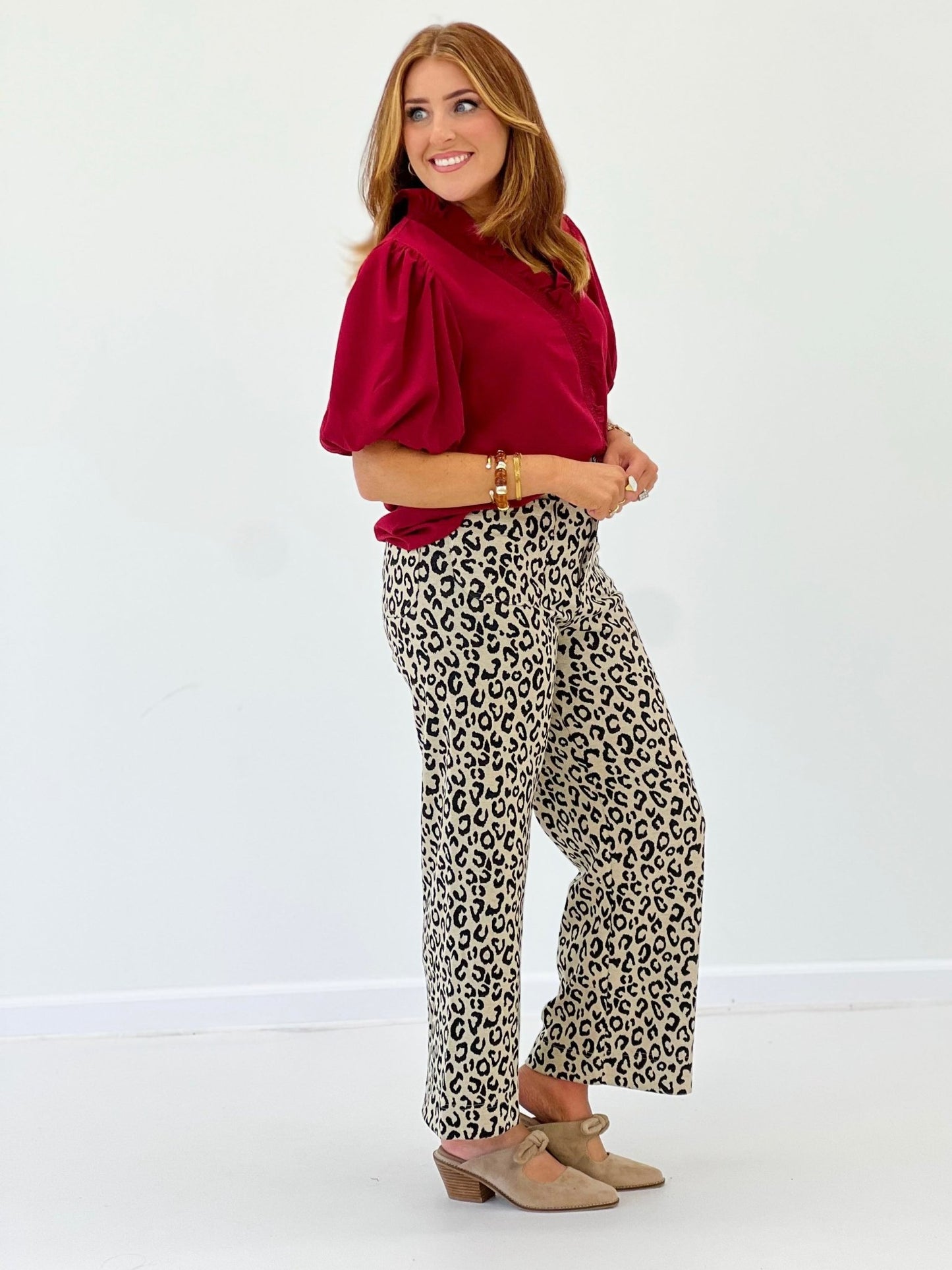 Smocked bubble sleeve blouse with a flared hem