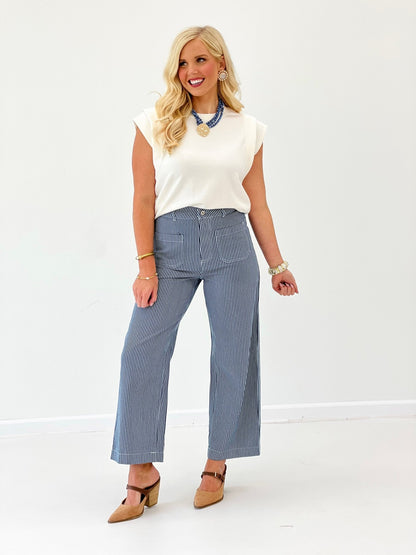 Cream double band sleeve top with short cuffed sleeves and round neckline
