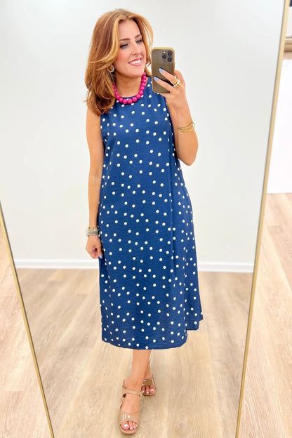 Polka dot dress falling to a midi length