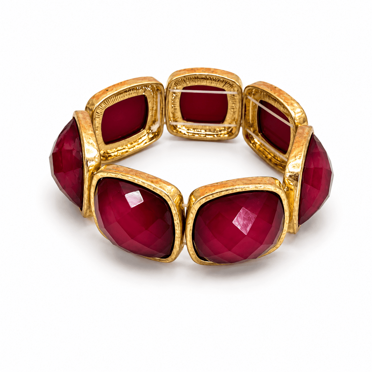 Square cut stone bracelet in a gold-tone setting