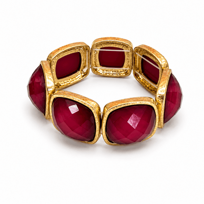 Square cut stone bracelet in a gold-tone setting