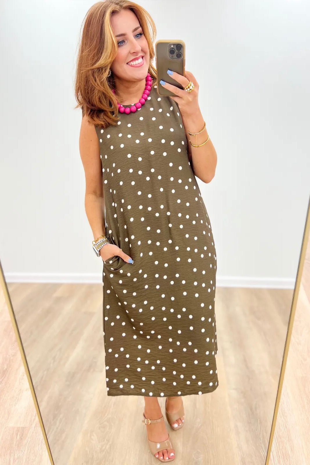 Sleeveless midi dress with an allover spot print