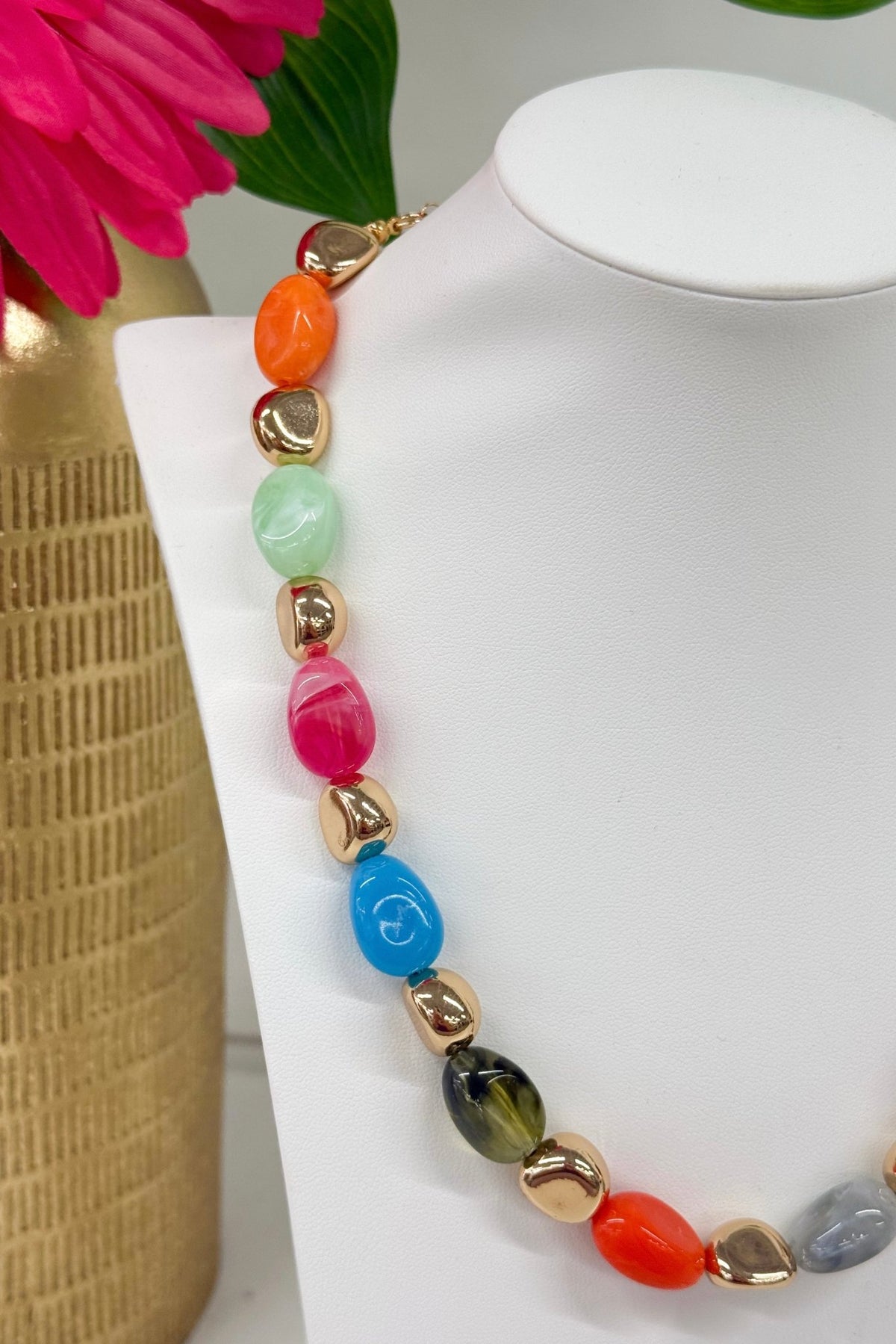 Beaded necklace with scattered colored stones