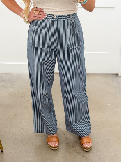 Striped navy pants with a relaxed leg and front pockets