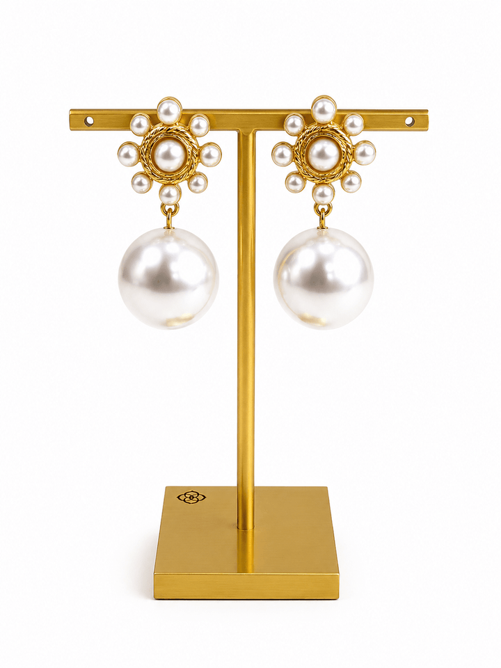 Gold flower earrings studded with cream pearls