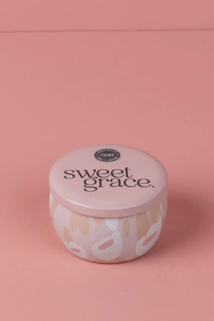 Pink and white tin candle in the Sweet Grace scent