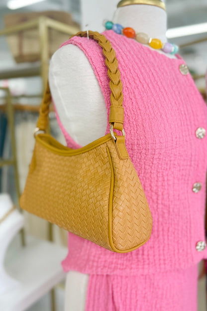 Tan basket-style woven bag with braided handles