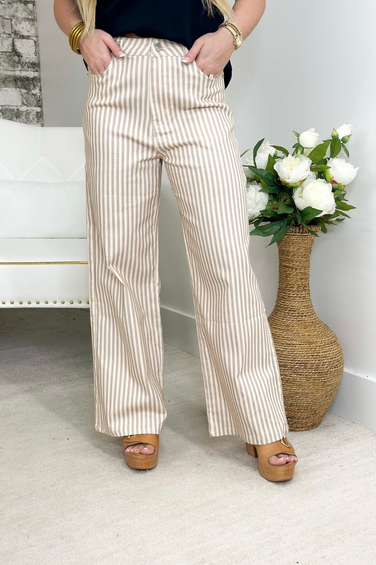 Tan striped pants with a straight hem