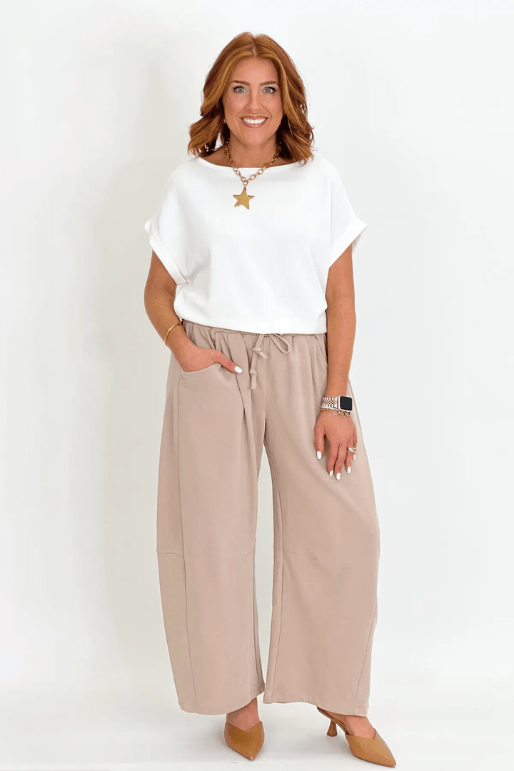 Taupe knit pants with a barrel leg shape