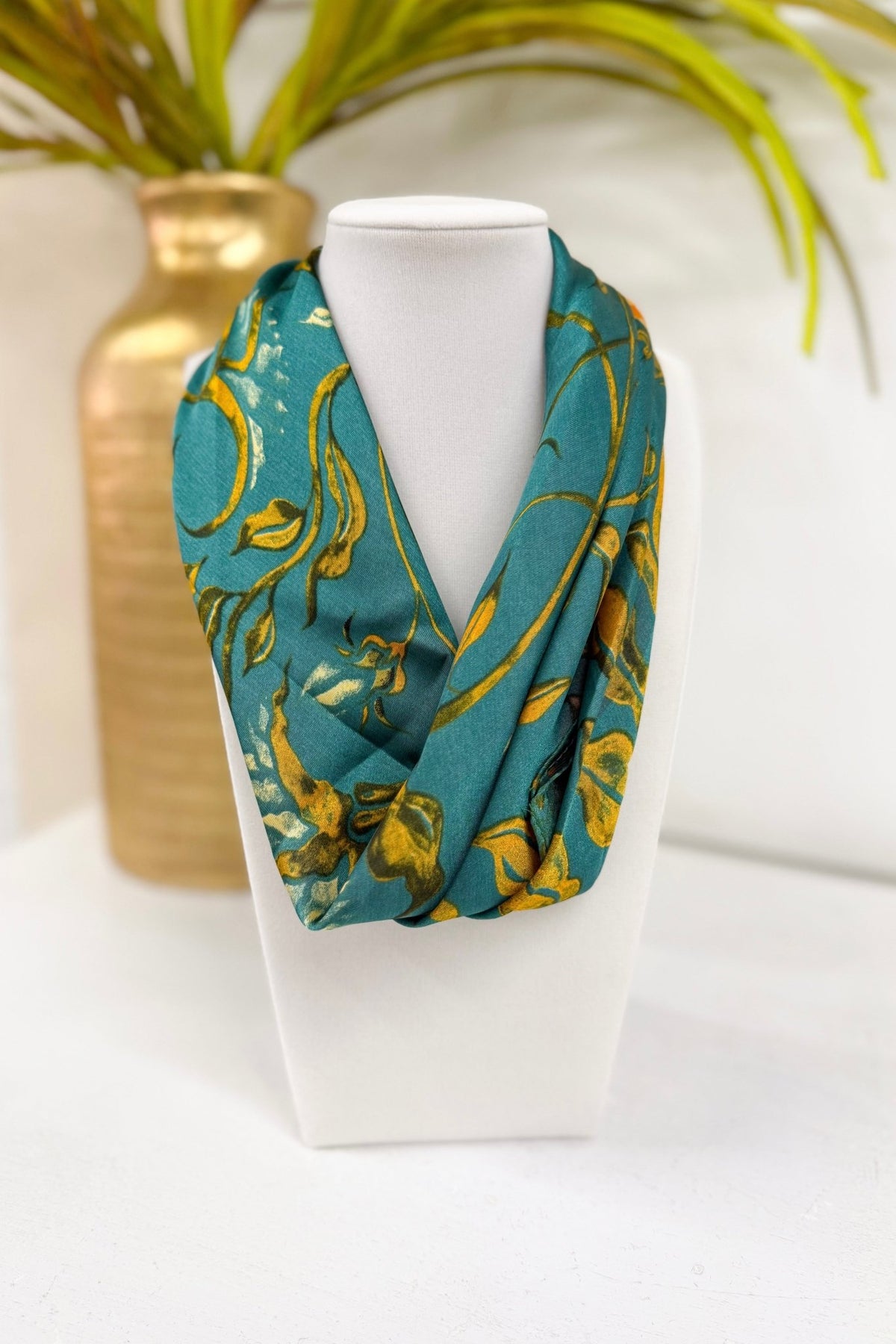 Teal bandana with a floral vine border print
