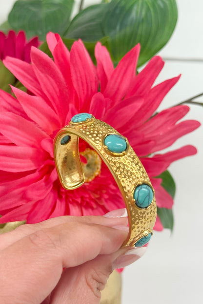 Gold bangle set with turquoise stones