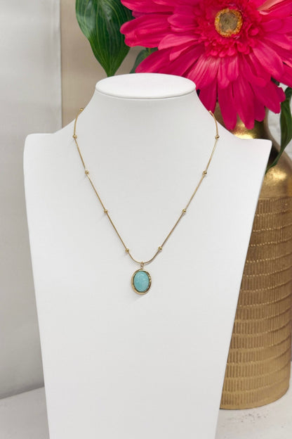Oval turquoise stone on a gold chain