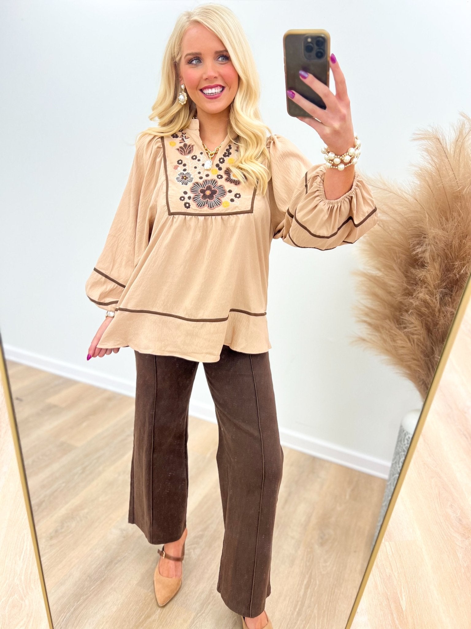 Oat long sleeve top with embroidered detail at the v-neck