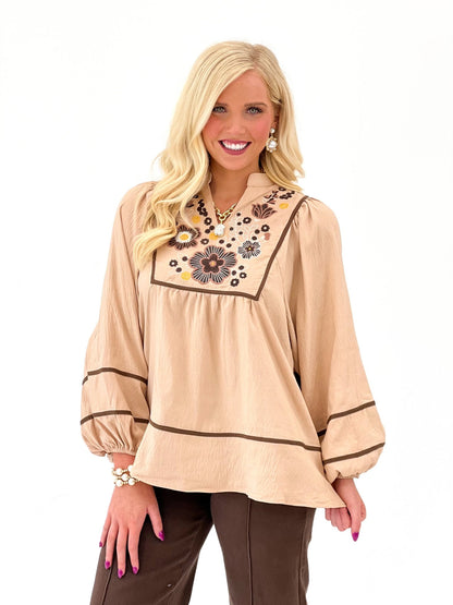 Long sleeve oat blouse with a stitched v-neckline