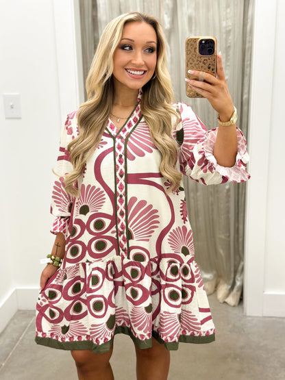 Button placket detail on a rose floral shirt dress