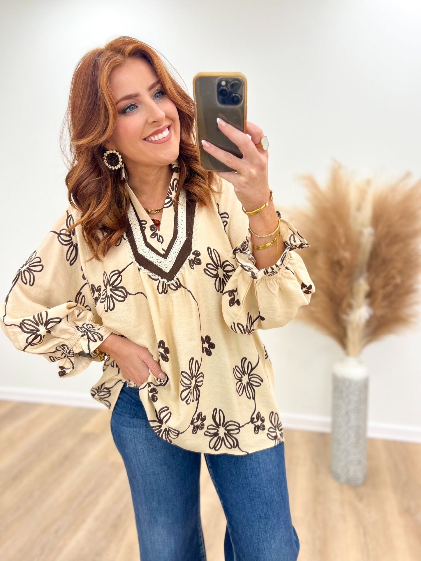 Lightweight ecru floral blouse with a v-neck opening
