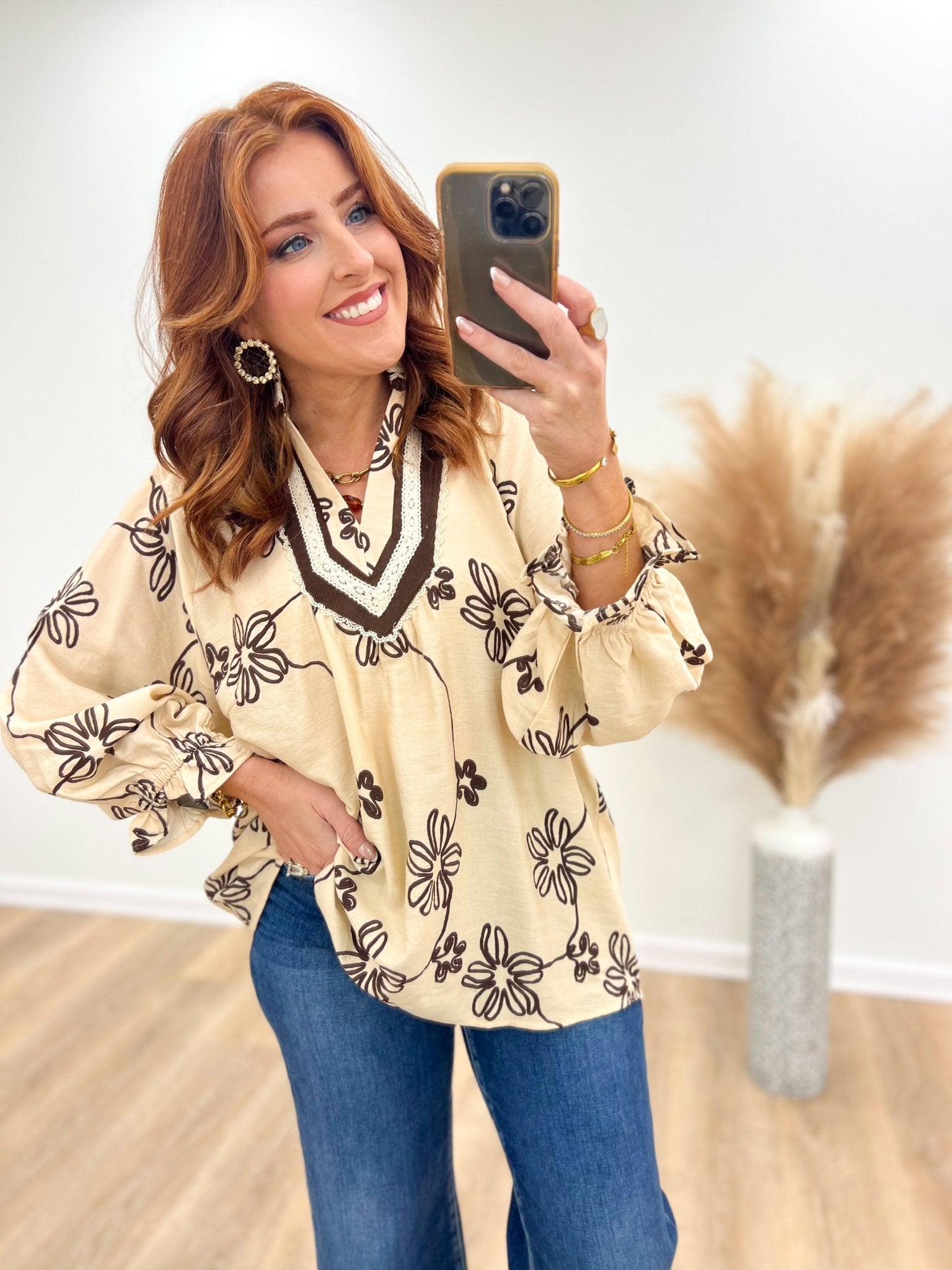 Lightweight ecru floral blouse with a v-neck opening