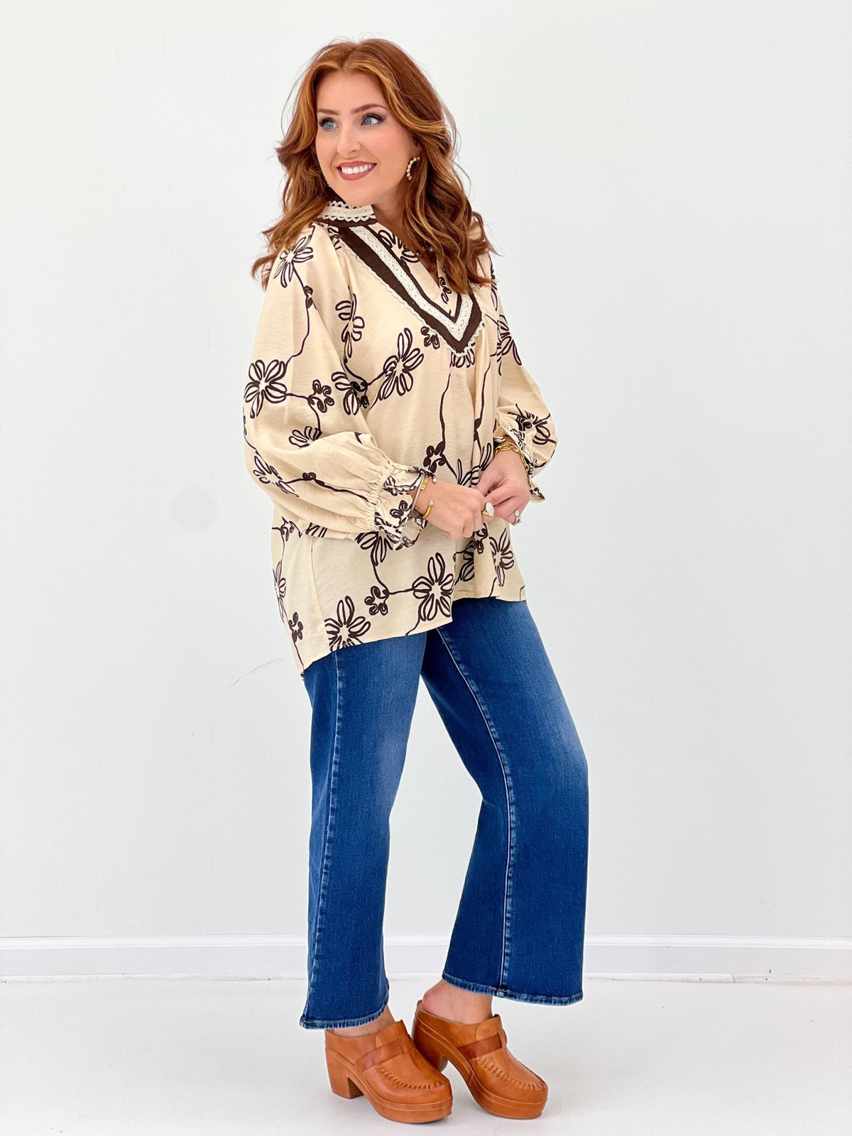 Ecru v-neck blouse patterned with small florals