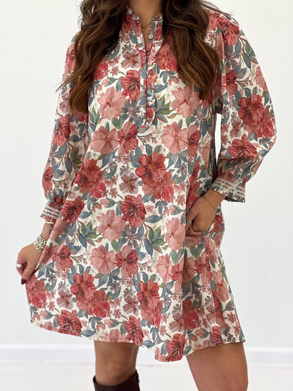 Rust floral ruffled mini dress detail with button-front and gathered sleeve cuffs