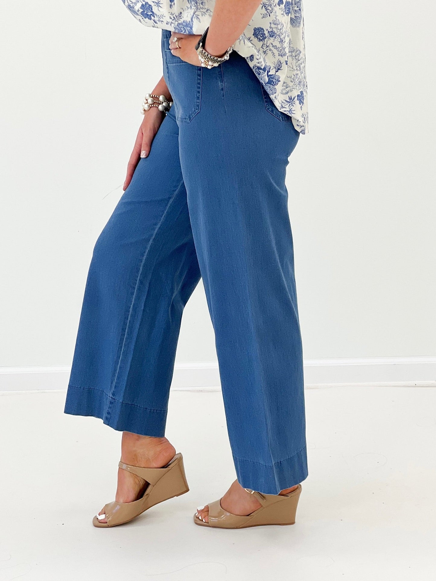 Light wash high rise jeans with a long straight hem