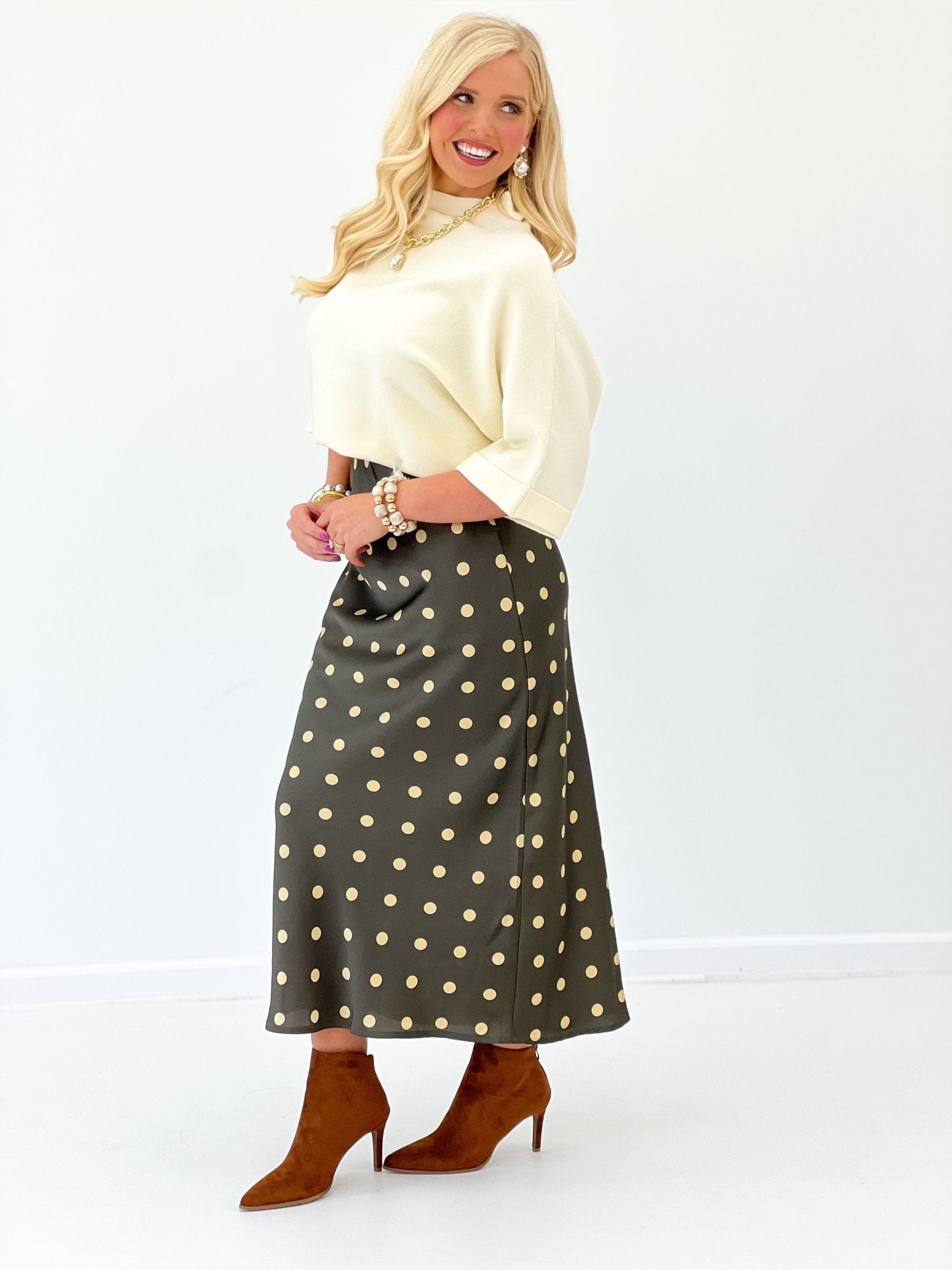 Loose knit sweater with a folded mock neck