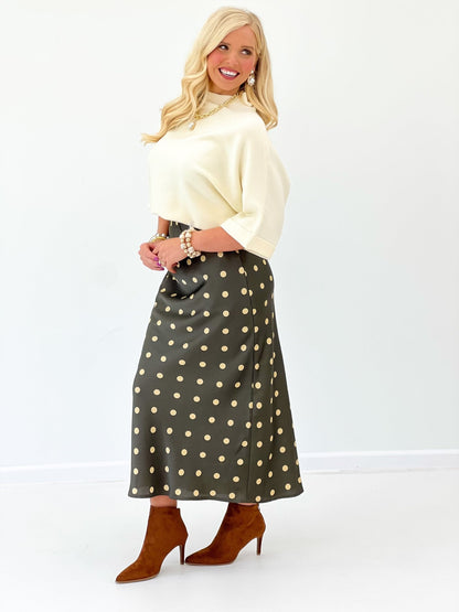 Loose knit sweater with a folded mock neck