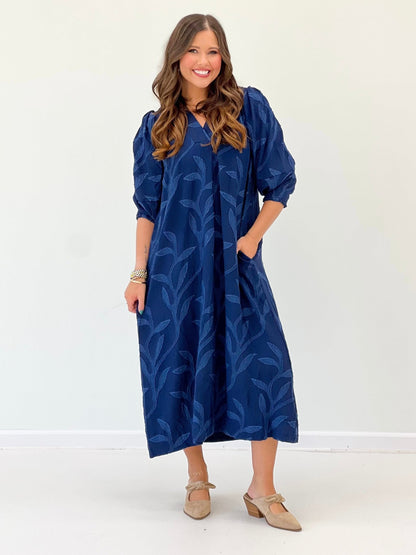Navy midi dress with an open collar neckline
