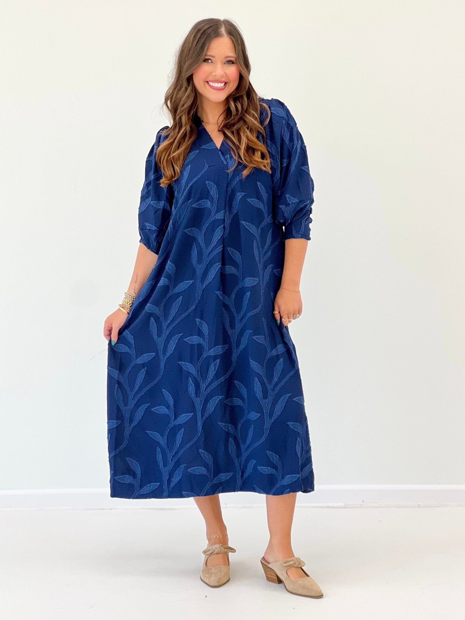 Navy dress with a relaxed open neckline
