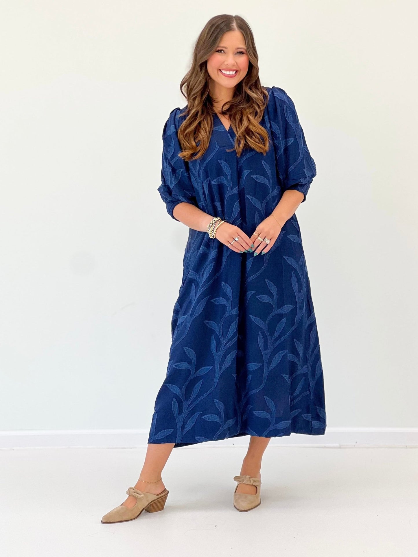 Open collared dress in navy, cut to midi length