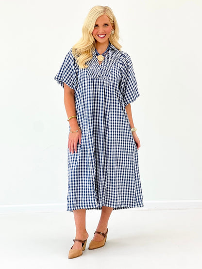 Denim blue plaid smocked midi dress with flutter sleeves and button-front