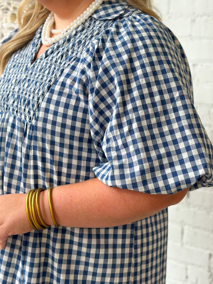 Plaid dress with smocking across the shoulders