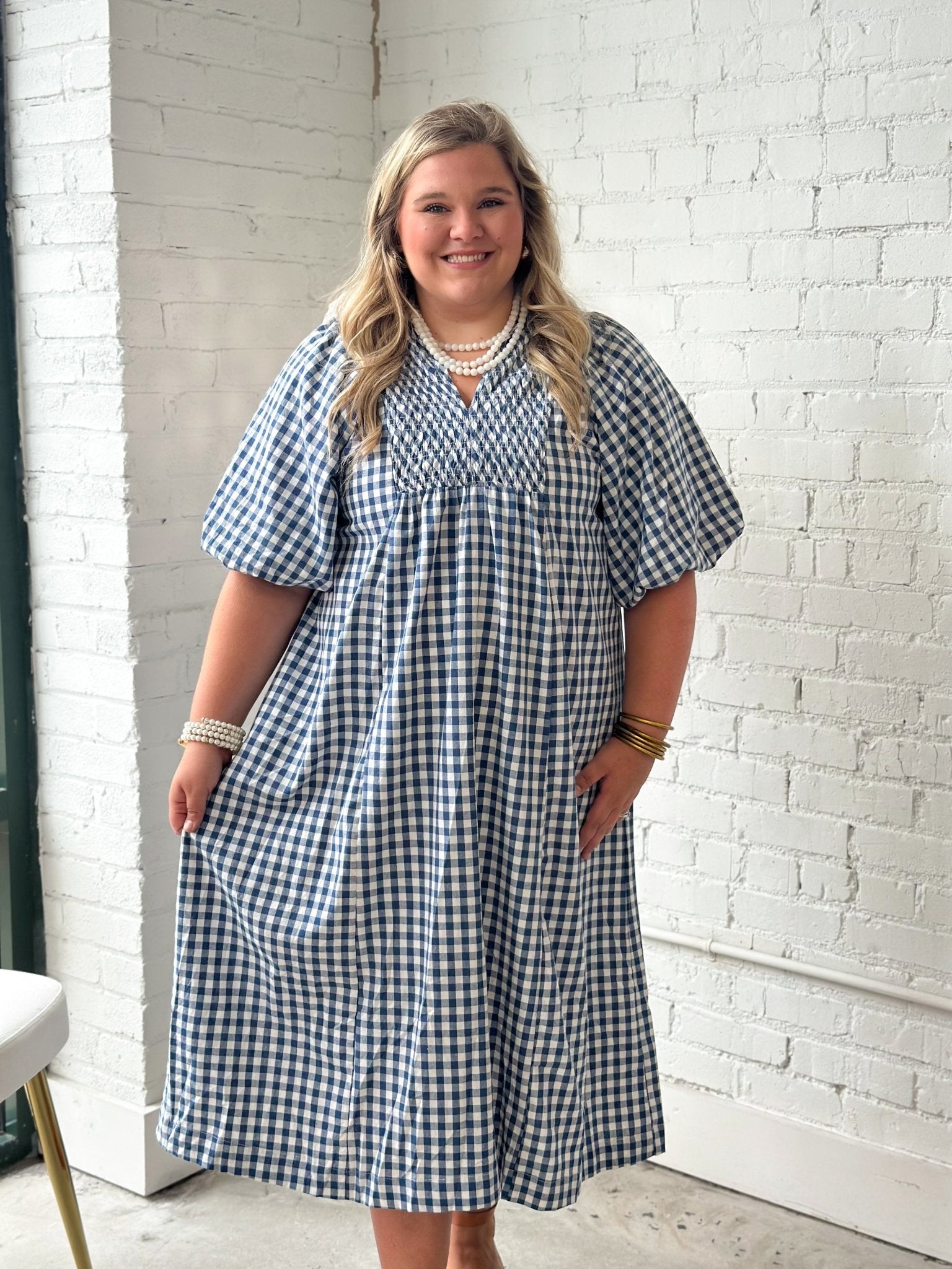 Smocked yoke detail on a plaid midi dress