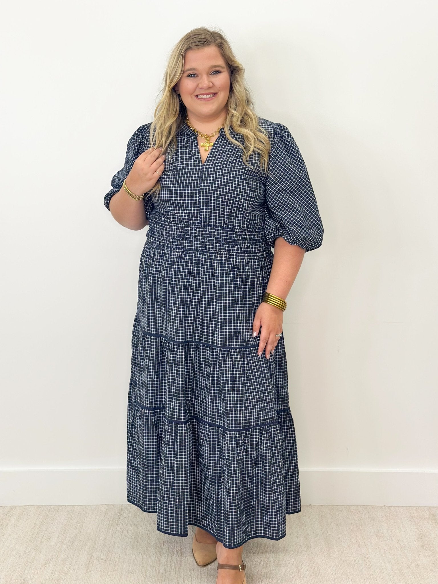 Tier detail on a navy plaid midi dress