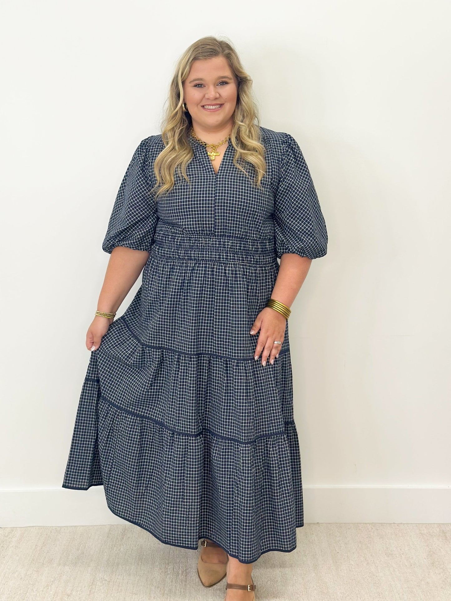 Tiered plaid dress in navy, cut to midi length