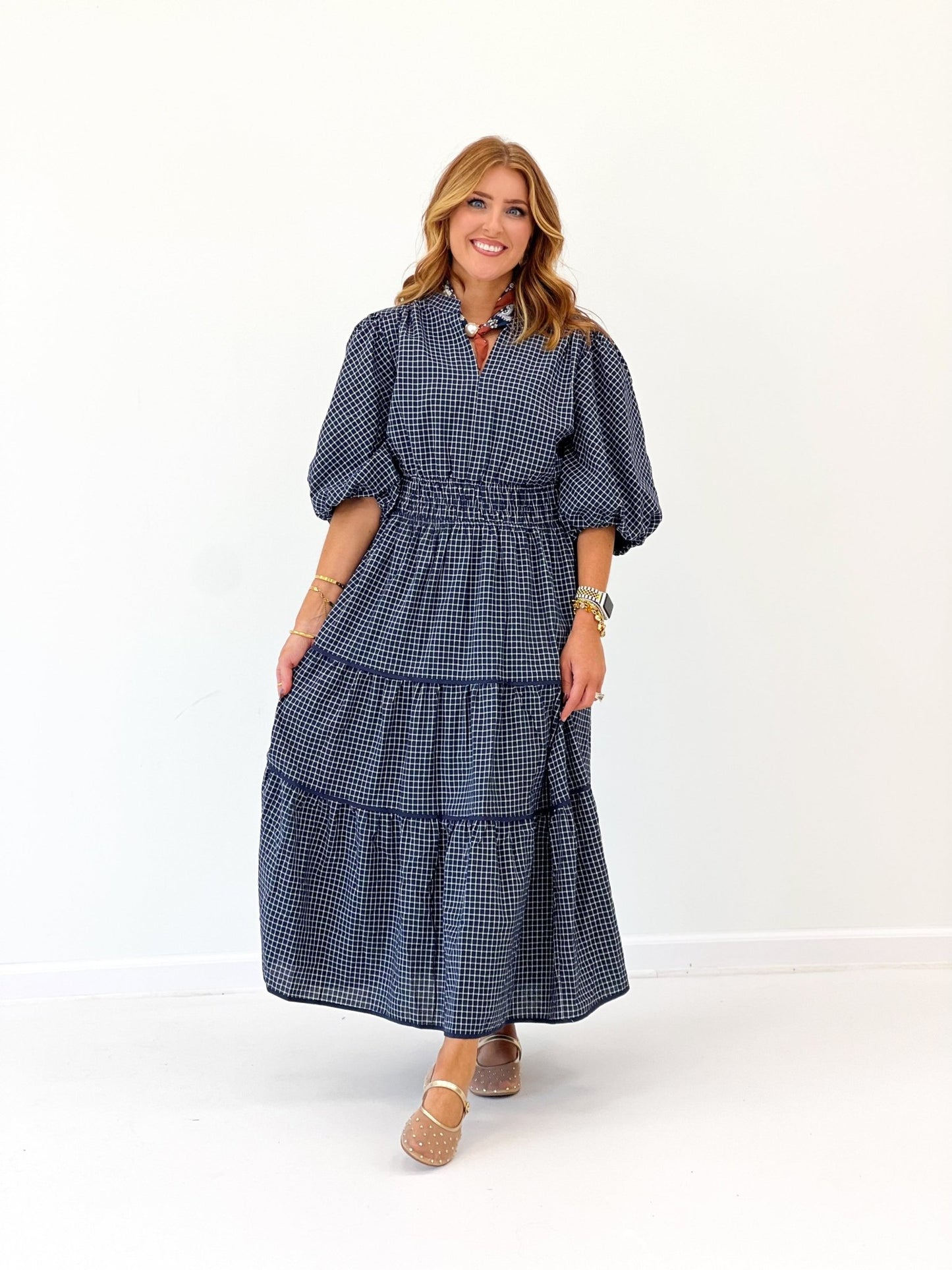 Navy plaid dress with gathered tiers at the hem