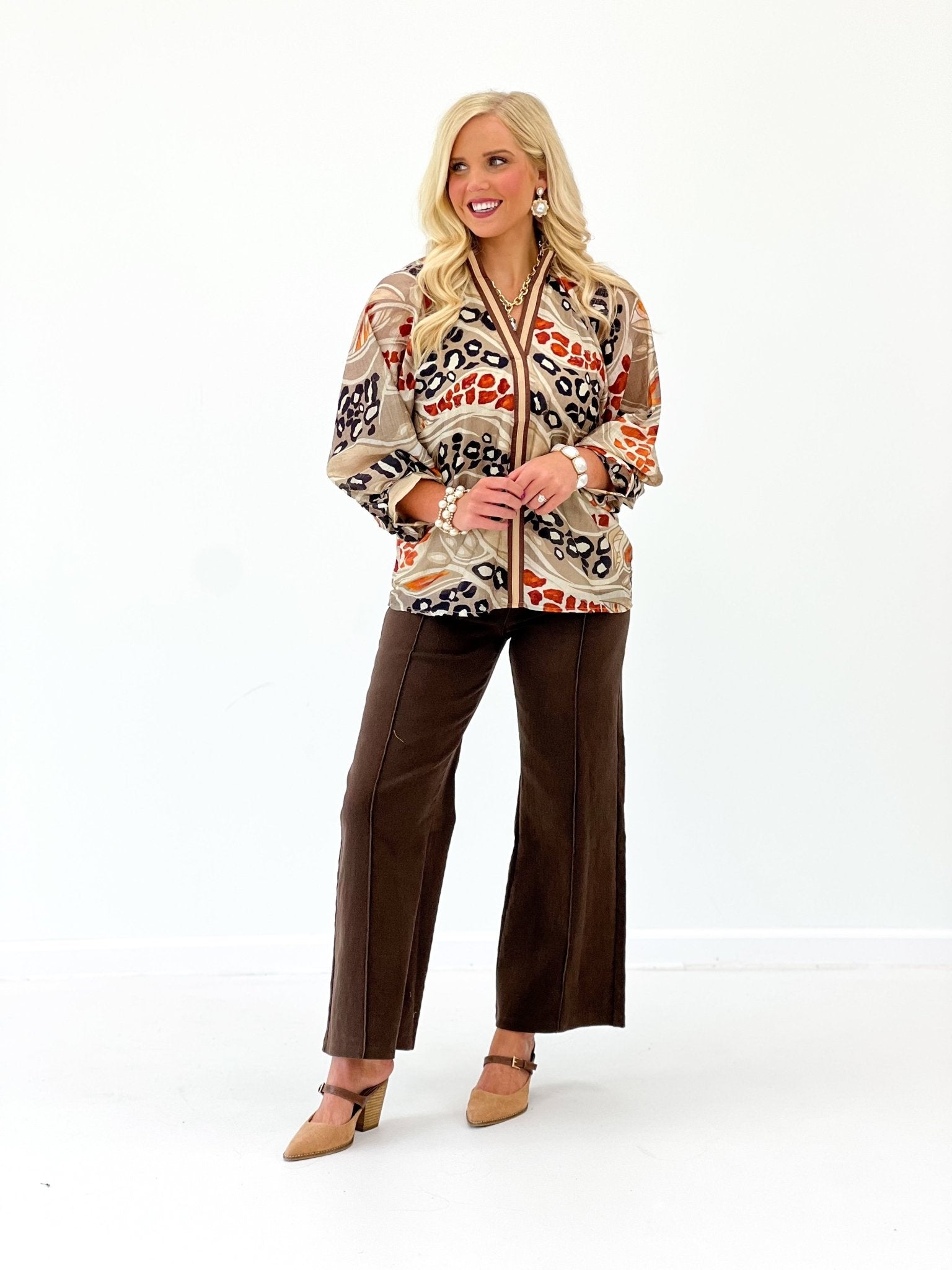 Mocha top with an allover print and smocked yoke