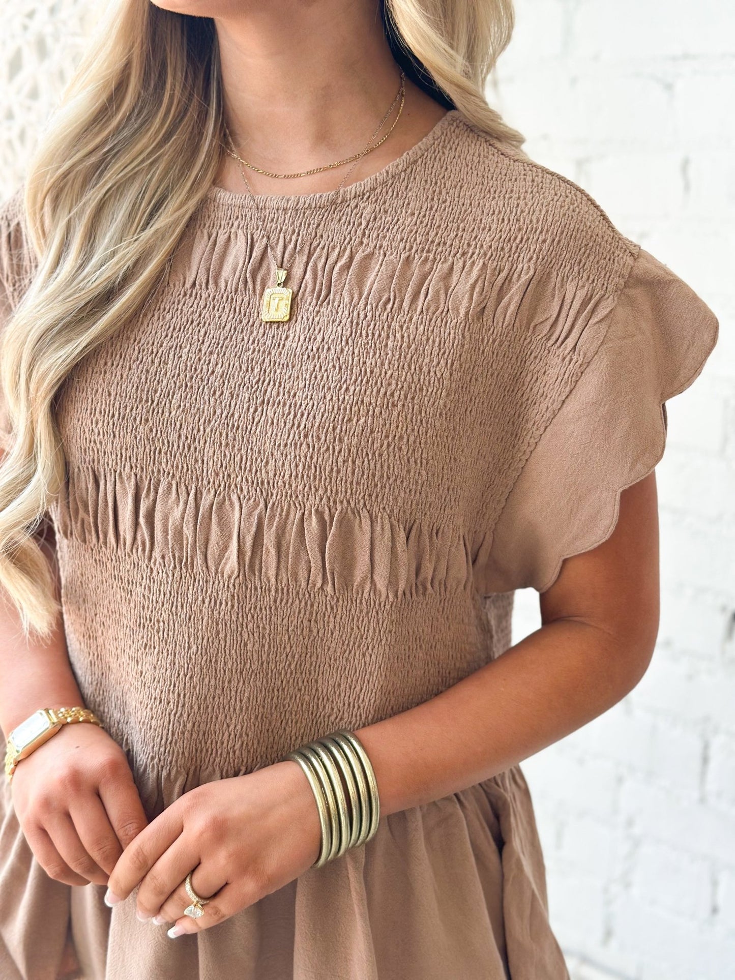 Scalloped sleeve top with a gathered neckline