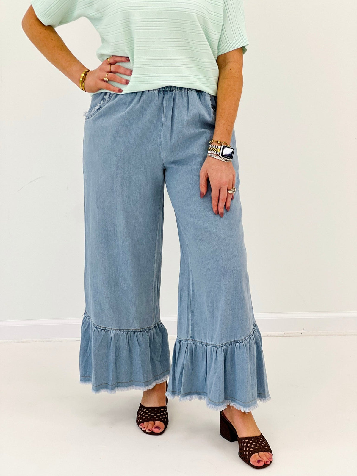 Denim pants with layered tiers at the ankle