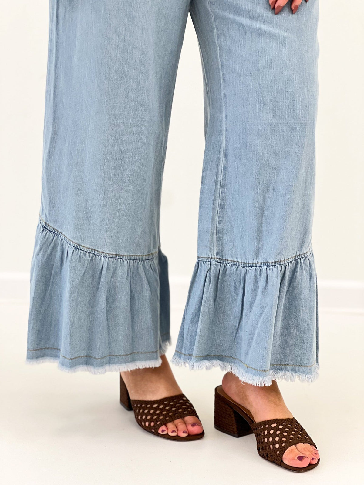 Denim pants with a tiered flounce hem
