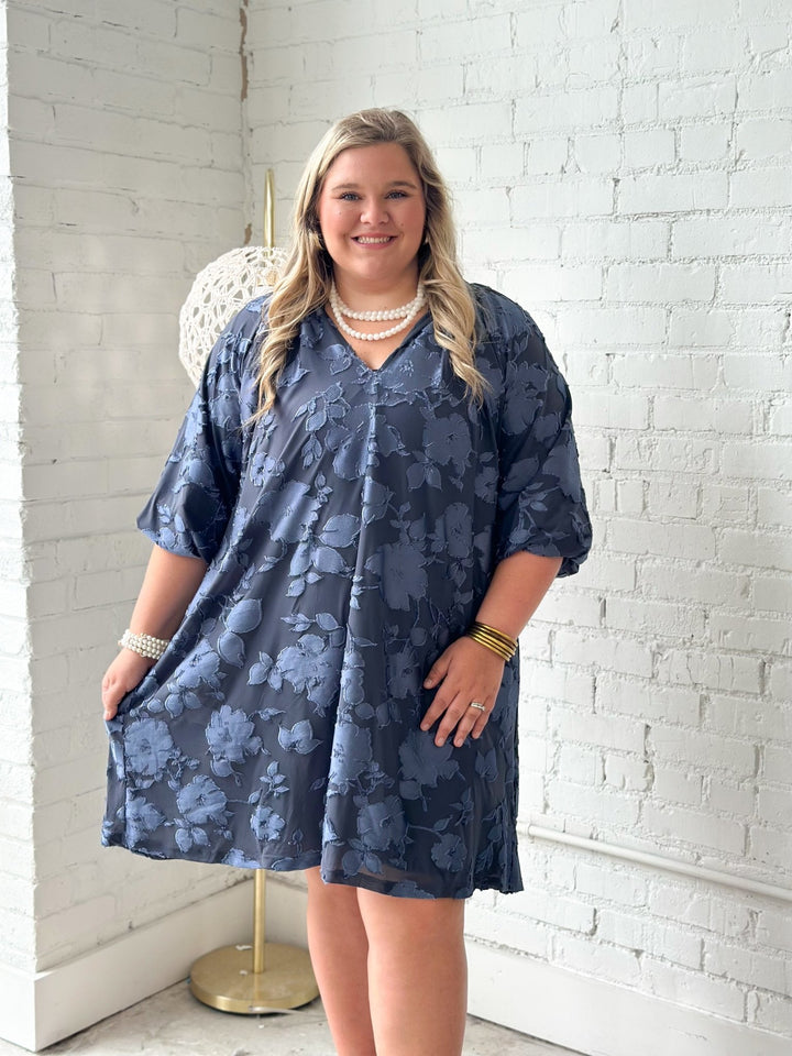 Slate blue velvet dress with scalloped edging and long sleeves