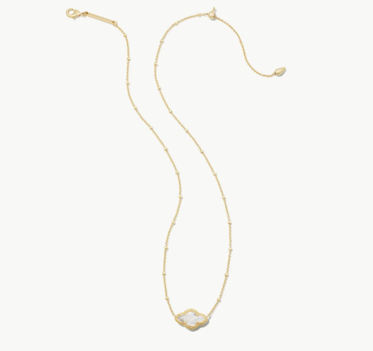Gold pendant necklace with small ivory MOP heart-shaped charm, adjustable chain