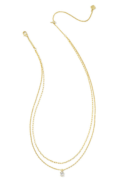Multi-strand gold crystal necklace with small white crystal cluster pendant