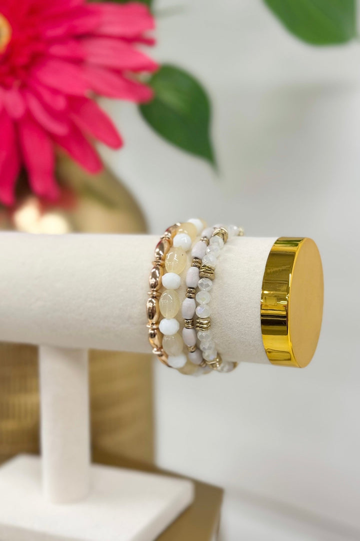 Four-row white glass and wood bead bracelet
