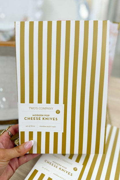 Set of cheese knives with white beaded handles in gift packaging