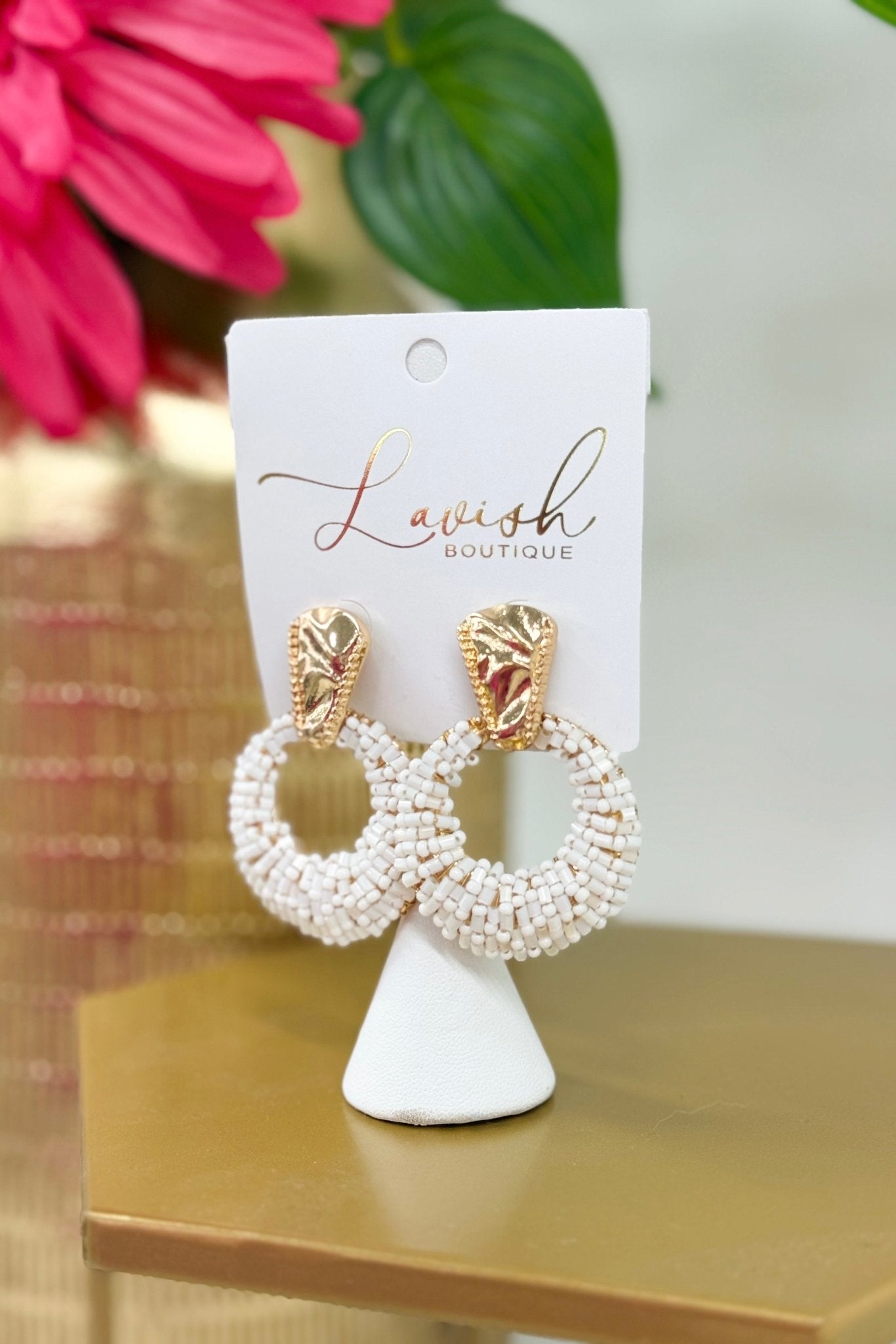 Door knocker earrings wrapped in white beads