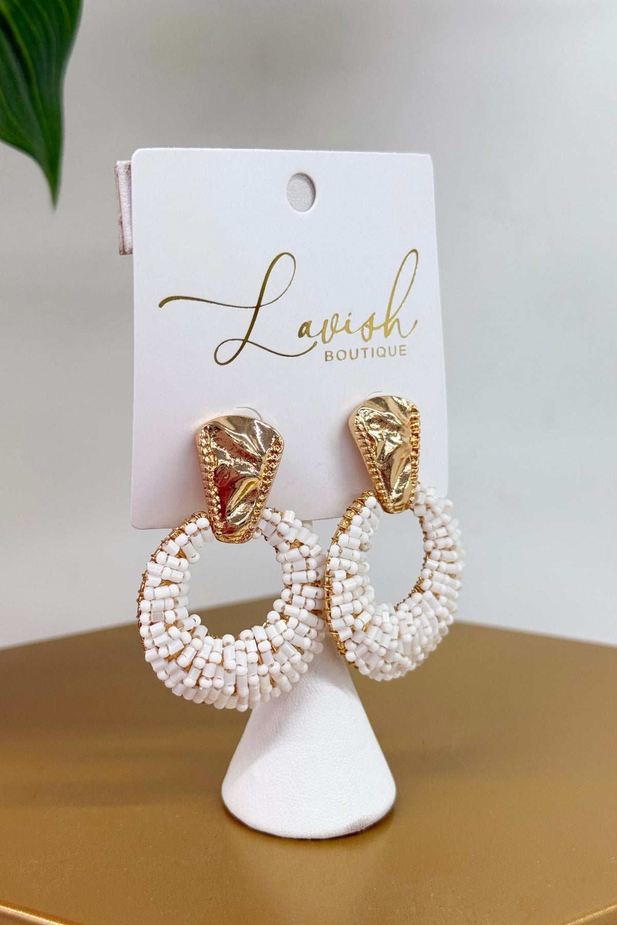 White bead covered statement earrings
