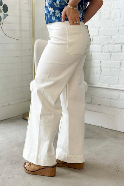 White wide leg jeans with a button and zip front