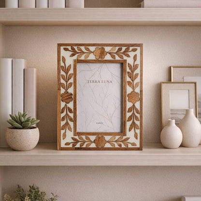 White and brown wooden photo frame with a carved petal border