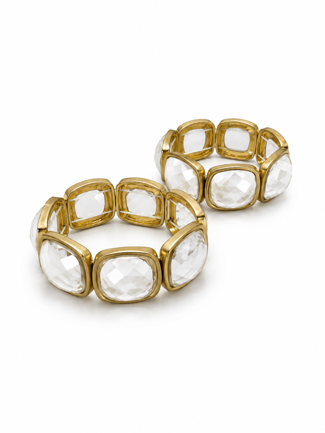 Wide faceted stone bracelet in a gold-tone setting